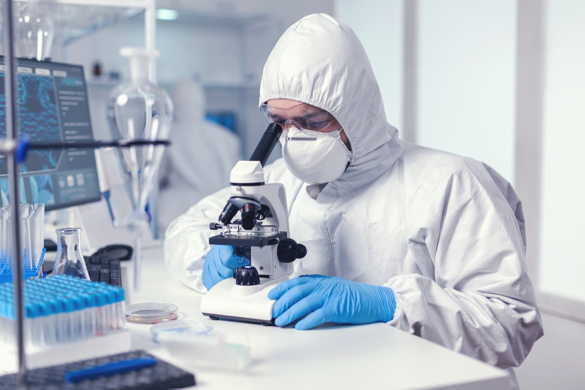 a researcher holding a syringe