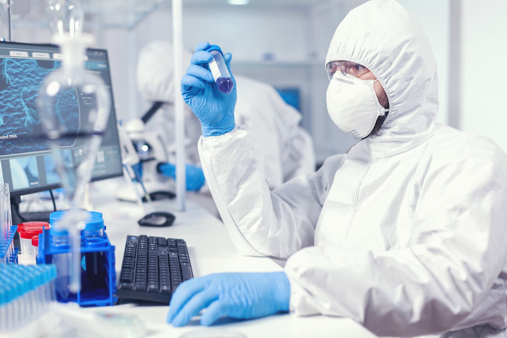 a researcher holding a syringe